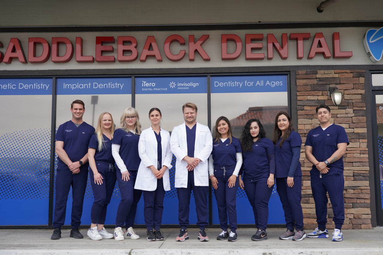 The entire saddleback dental team standing in front of our dental office in mission viejo