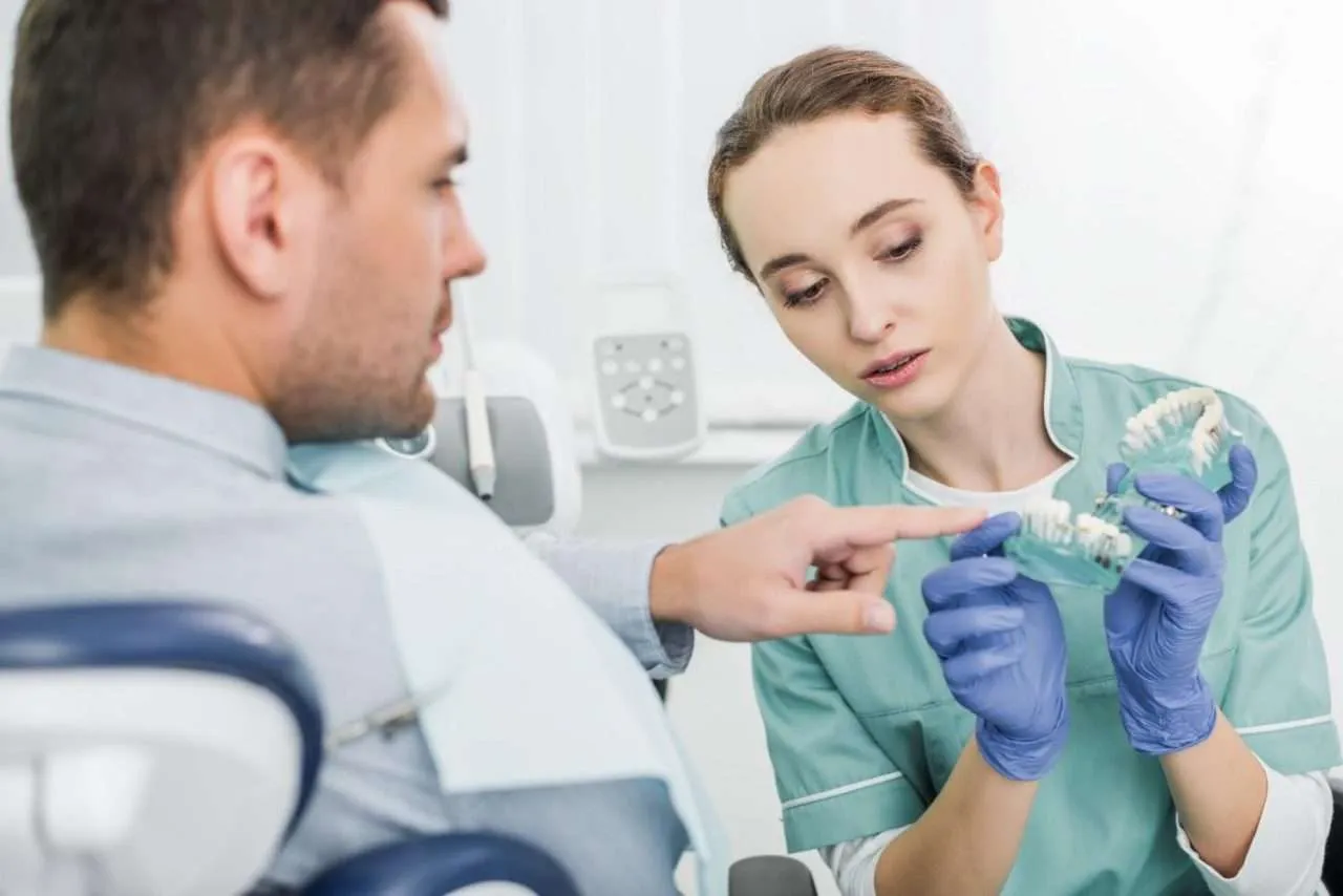 dentist showing patient some affordable dental implants Mission Viejo ca