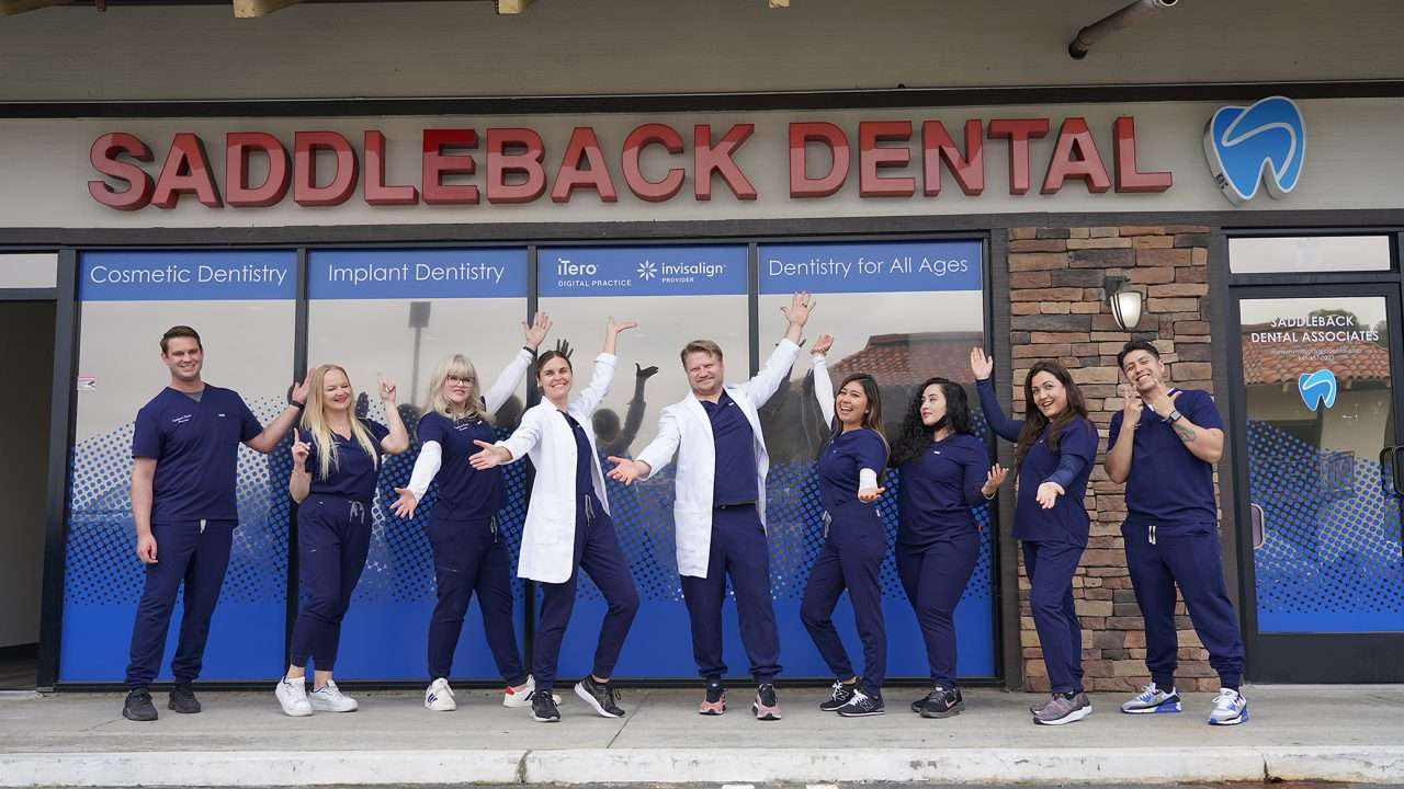 Saddleback dental team posing for a group photo outside their Mission Viejo Dentist Office
